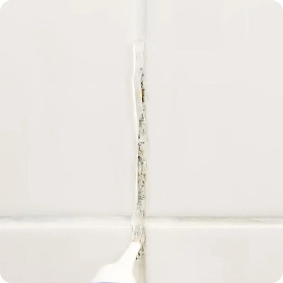 nuroclean-thick-gel-clings-to-surfaces Thick NuroClean gel clinging to vertical grout with mold stains